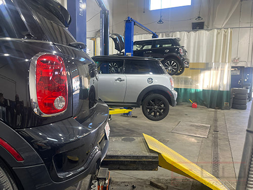 Our Calgary mechanics servicing 3 minis in our bay